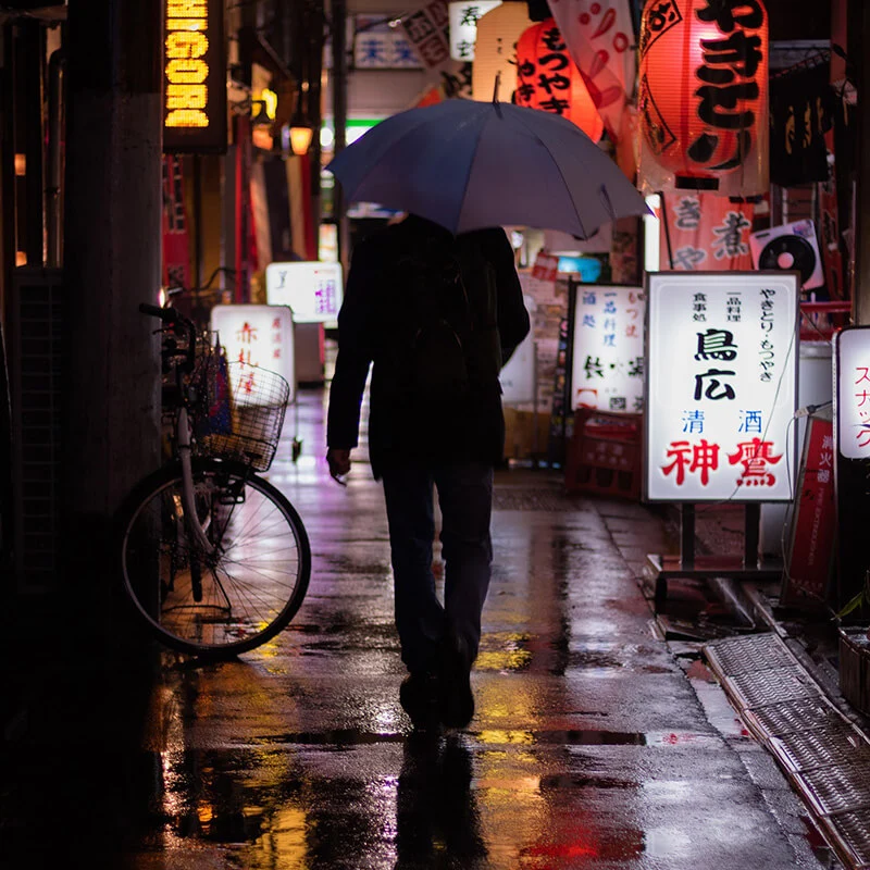 Rainy night alley with neon signs, Tokyo